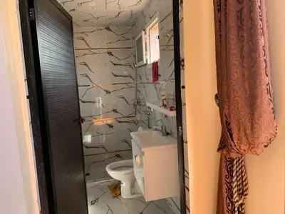 a bathroom with a toilet and a sink at familly house in Tamaris