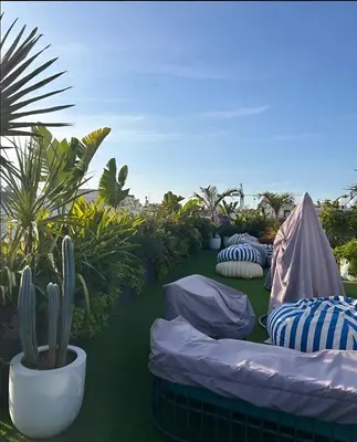 a group of bean bags on a lawn with plants at Le Claridge - Cosy Studio - By Mi-Haven in Casablanca