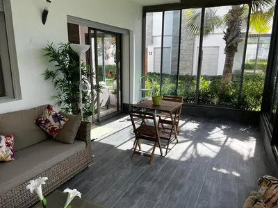 a living room with a couch and a table at Villa Blanca - by Nero in Sidi Rahal