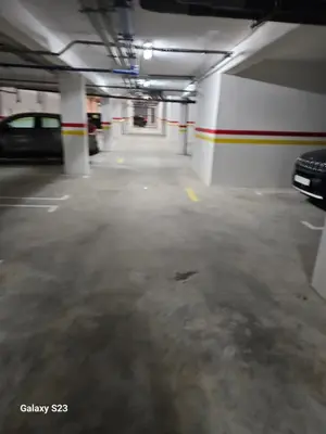 an empty parking garage with a car parked in it at Appartement Harhoura La vallée pas loin de Arzana hotel in Temara