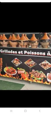 a sign for a restaurant with pictures of food at appartement de lux vue piscine 5 min plage bouznika in Bouznika