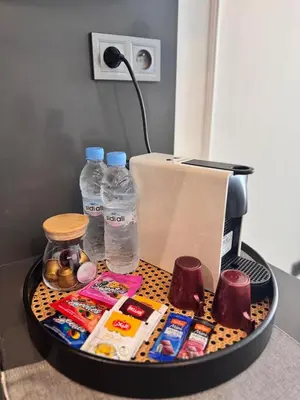 a container filled with food and water bottles on a counter at Central Maarif Studio in Casablanca