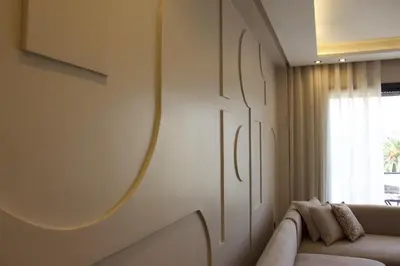 a living room with a couch and a mirror on the wall at Chic & central in Maarif