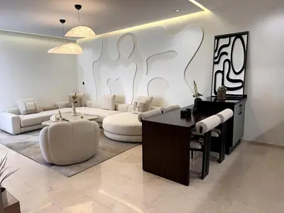 a living room with a couch and a table at Comfortable & Central Casablanca Apartment in Casablanca