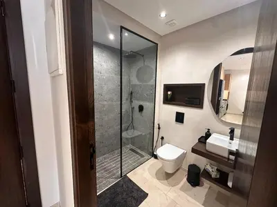 a bathroom with a shower and a toilet and a sink at Comfortable & Central Casablanca Apartment in Casablanca