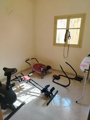 a room with a gym with exercise equipment on the floor at Dar Isa in Sidi Rahal