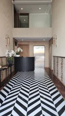 a lobby with a black and white checkered floor at Studio Cosy les Princesses in Casablanca