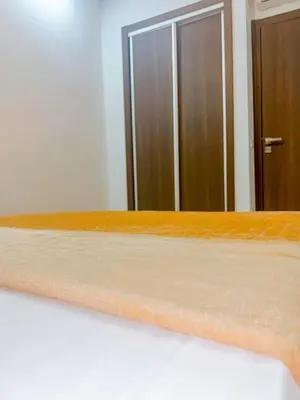 a close up of a bed in front of a mirror at Living Like Home in Casablanca
