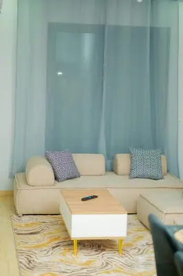 a living room with a couch and a coffee table at Living Like Home in Casablanca