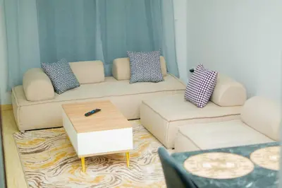a living room with a couch and a coffee table at Living Like Home in Casablanca