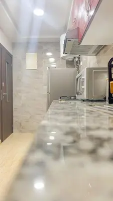 a kitchen with a counter top with a microwave at Living Like Home in Casablanca