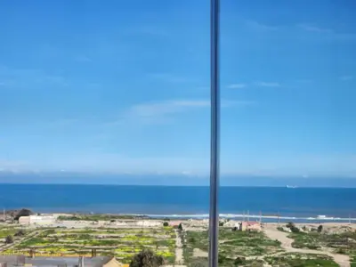 a view of the ocean from a room with a window at Studio Zen vue sur mer in Aïn Harrouda