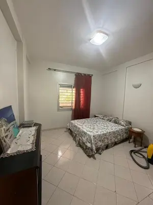 a bedroom with two beds and a window in it at Appartement central familial avec grande terrasse in Casablanca