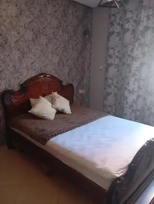 a bed with two pillows on it in a bedroom at Elegant apartment in Rabat in Rabat