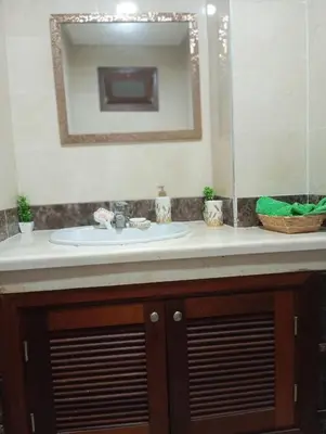 a bathroom counter with a sink and a mirror at Elegant apartment in Rabat in Rabat