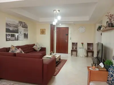 a living room with a couch and a table at Elegant apartment in Rabat in Rabat