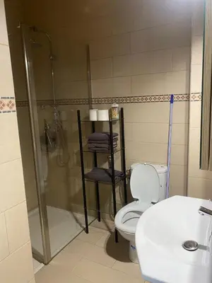 a bathroom with a shower and a toilet and a sink at Appartement location saisonnière Mohammedia in Mohammedia