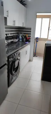 a kitchen with a stove and a dishwasher at Calme absolu in Aïn Harrouda