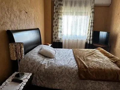 a bedroom with a large bed and a window at Villa in mohammadia morrocco in Mohammedia