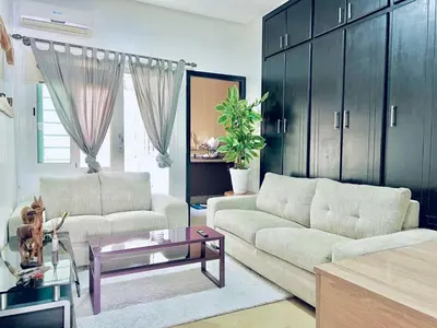 a living room with a couch and a table at Apartment in rabat agdal in Rabat
