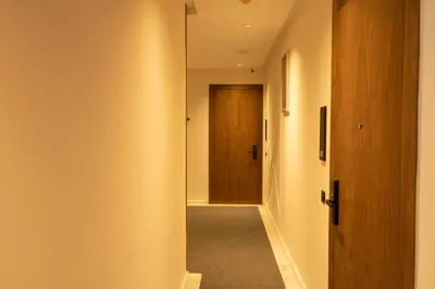 a hallway with a mirror and a door at Comfort & Premium in Casablanca