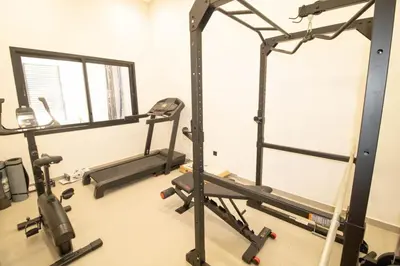 a gym with two tread machines and a treadmill at Comfort & Premium in Casablanca