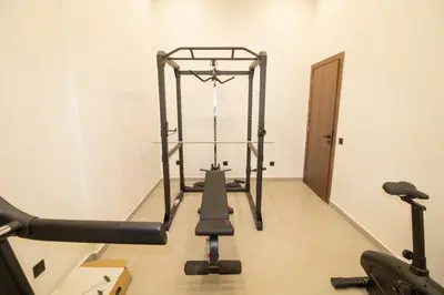 a room with a gym with a treadmill at Appartement Ferme Bretonne - Confort & Premium in Casablanca