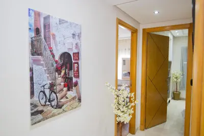 a hallway with a painting on the wall at R106- Amazing & Colourful Apartment near High Speed Train Station in Casablanca