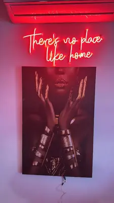 a neon sign that says theres no place like home at Studio a maarif in Maarif