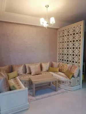 a living room with a couch and a coffee table at Apparemment haut standing Mansbay in Mohammedia