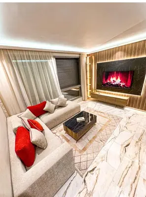 a living room with a couch and a fireplace at Studio luxueux in Casablanca