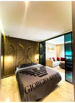 a bedroom with a bed and a couch at Studio luxueux in Casablanca