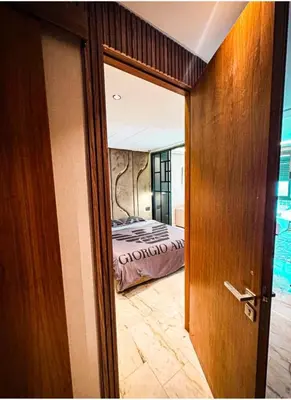 a door leading into a bedroom with a bed at Studio luxueux in Casablanca