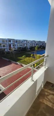a balcony with a view of a building at Belle Appartent Vue Piscine A Malaga Beach A Mansouria in Mansouria