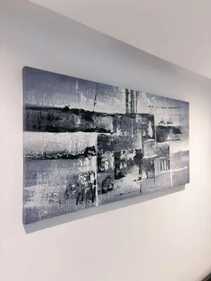 a painting hanging on a white wall at Studio cosy in Casablanca