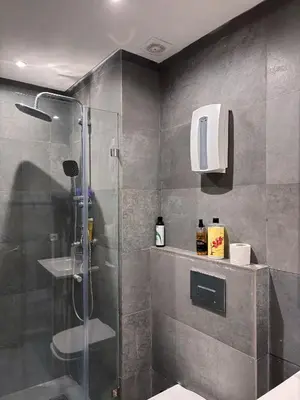 a bathroom with a shower and a glass shower stall at Studio cosy in Casablanca