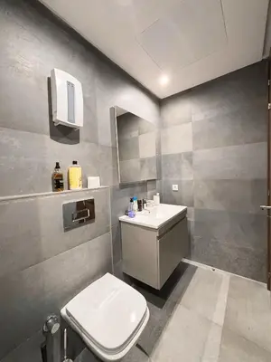 a bathroom with a white toilet and a sink at Studio cosy in Casablanca