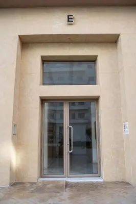 a glass door of a building with a window at Charming Studio for Rent with Pool Access & Kids Playground in Casablanca