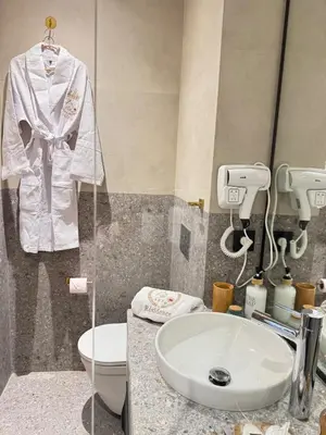 a bathroom with a white sink and a toilet at HBkf Residence in Casablanca
