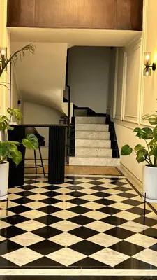 a lobby with a black and white checkered floor at HBkf Residence in Casablanca