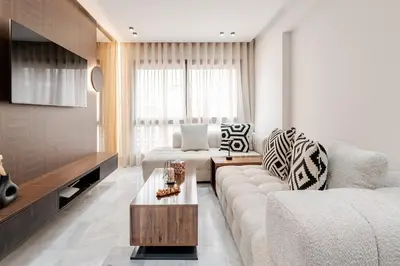 a living room with a couch and a coffee table at Maârif Elegance et confort in Casablanca