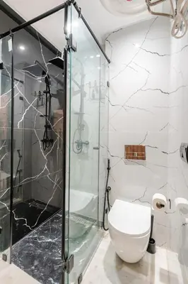 a bathroom with a glass shower and a toilet at VIVASTAY Casablanca - Cosy Maarif Arena 41 in Maarif