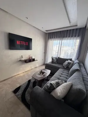 a living room with a couch and a table at Nova Casa in Casablanca