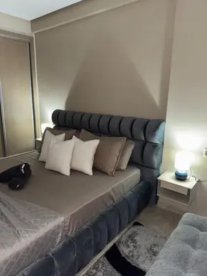 a bedroom with a large bed with white pillows at Nova Casa in Casablanca