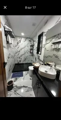 a bathroom with a white sink and a toilet at LA Princesse 12th in Casablanca