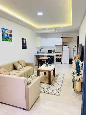 a living room with a couch and a table at Rafina in Casablanca