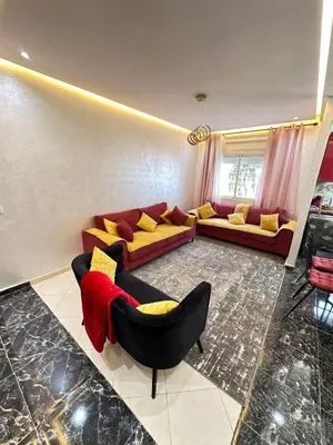 a living room with two couches and a couch at Apartment 1 CH près de la plage in Oulad Akkou