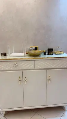 a white dresser with a counter top with at Charming apartment in Mansoria in Mohammedia
