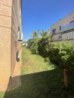 a view of a yard next to a building at Villa à louer nouaceur 3 chambres in Nouaseur