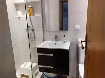 a bathroom with a sink and a shower at Appartement à 2mn gare tgv Agdal in Rabat